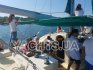 Гости отдыхают в кокпите на катамаране Contento - Yachts.ua